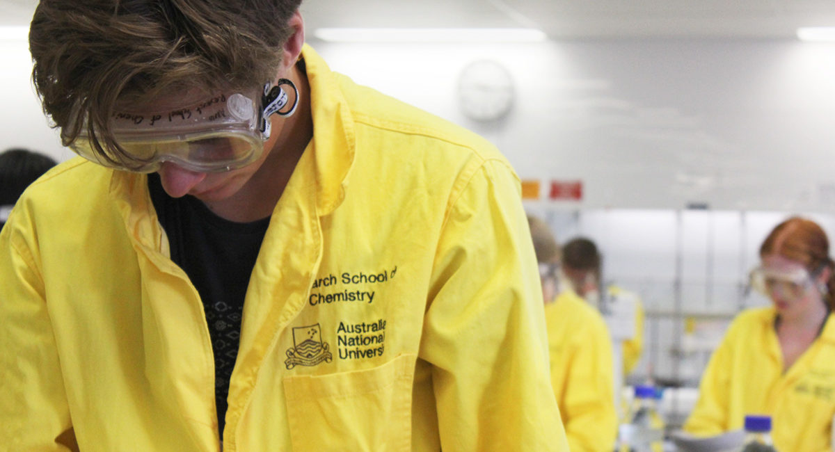 NYSF students wearing bright yellow scientist uniforms