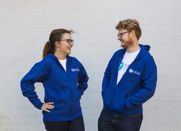 Female and male showcasing blue jacket