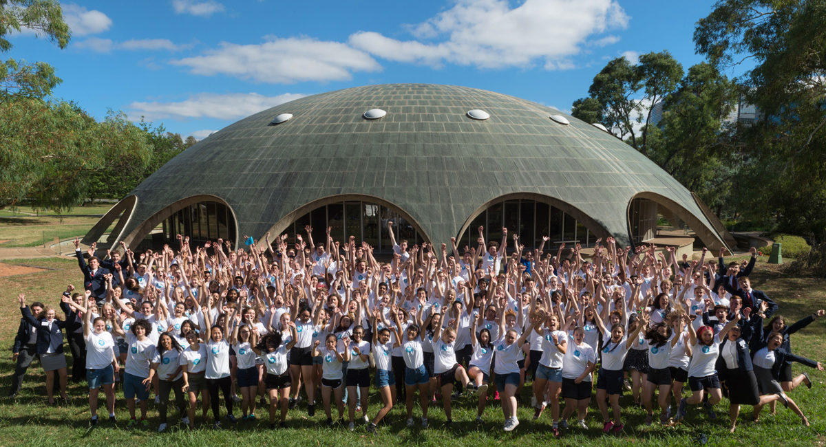 A large team of NYSF students cheering