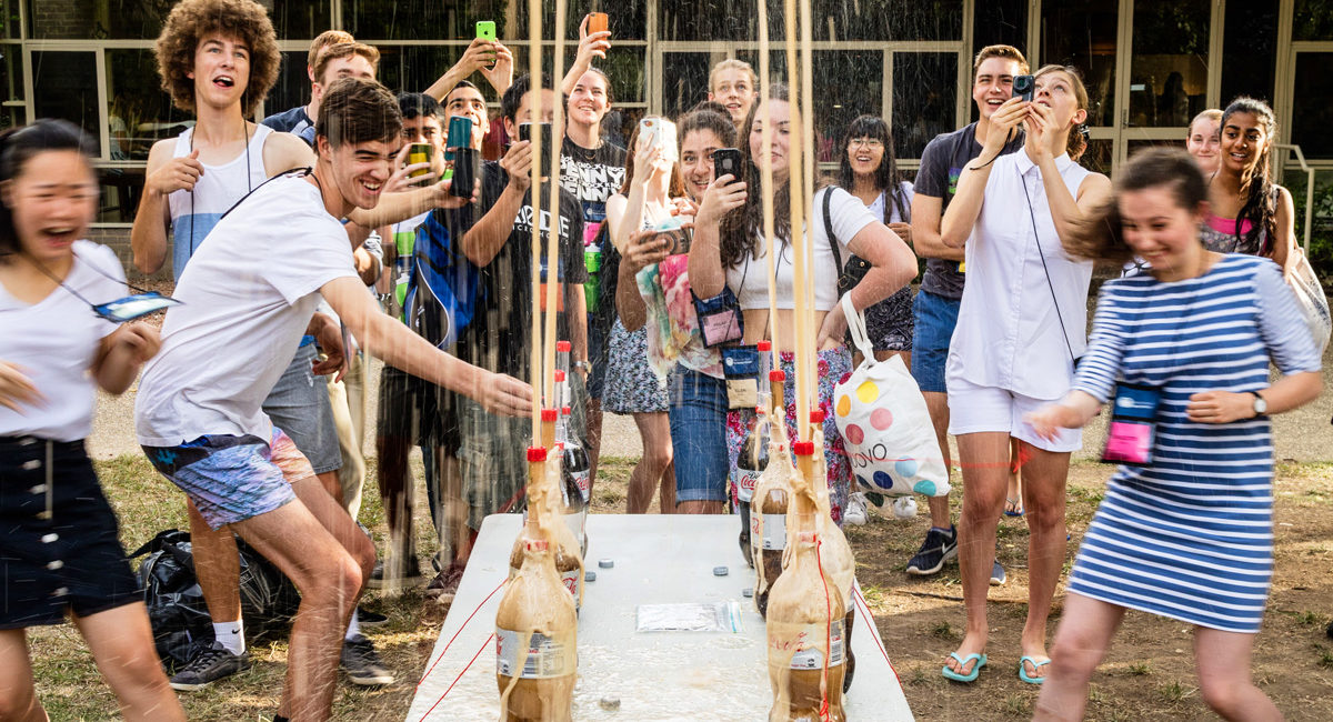 Students having fun with a 'Diet coke' and Mentos experiment