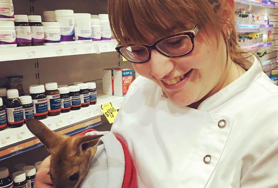 Alison Keane holding a baby kangaroo