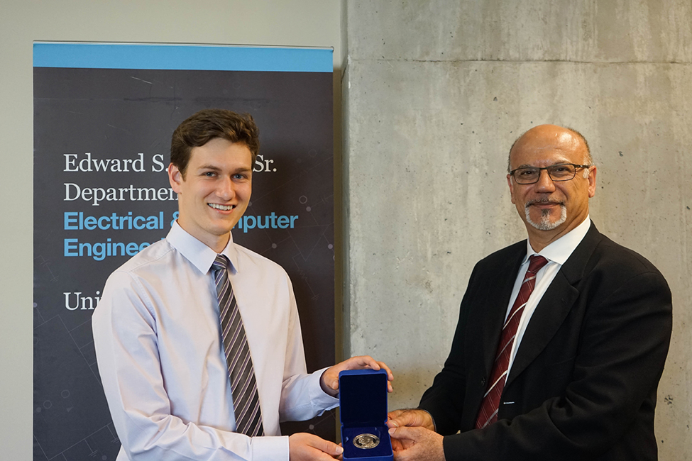 Young man receiving an award