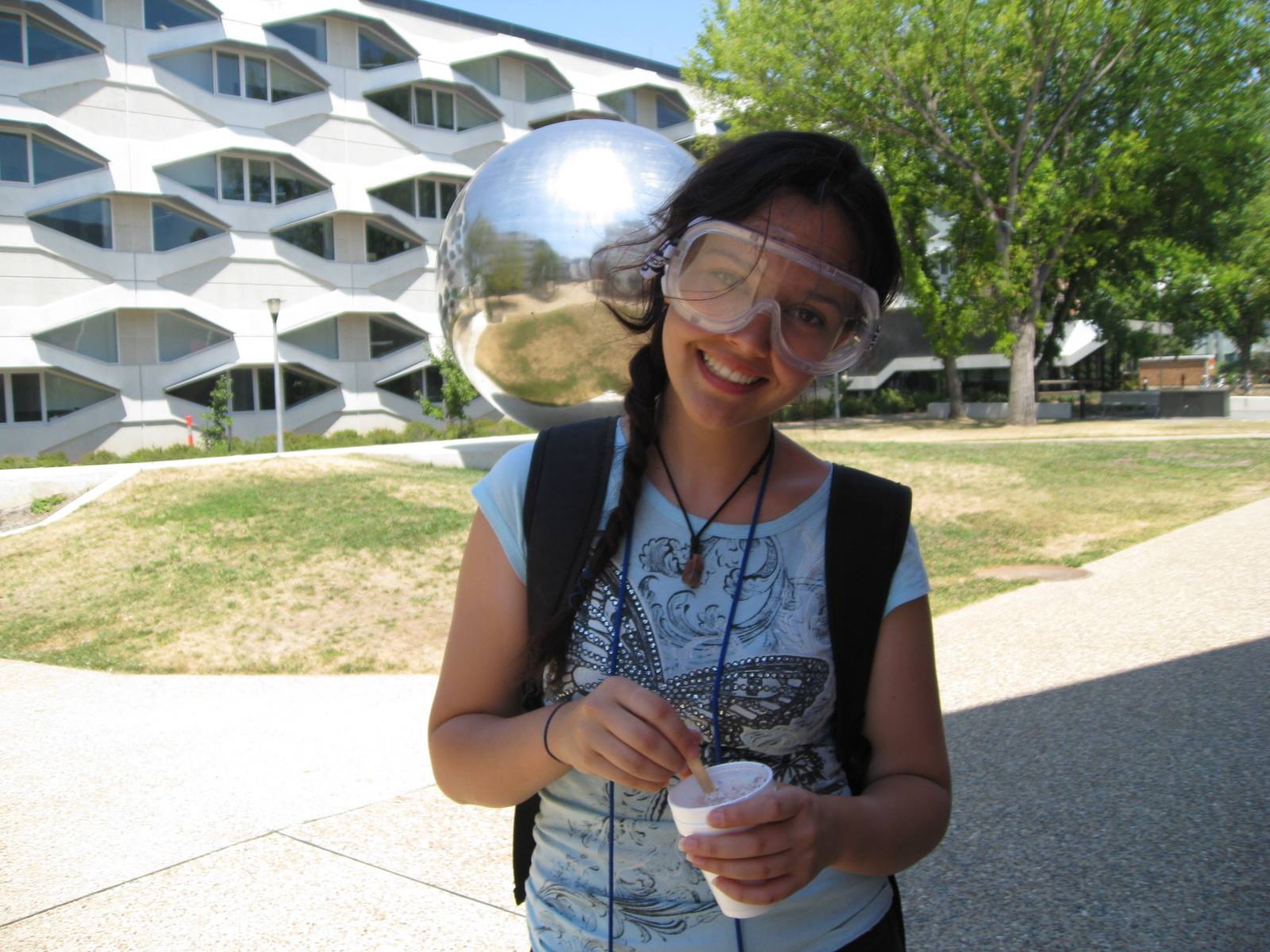 Natasha wearing lab goggles outside 